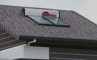 Solarmate solar hot water system panels on ioi house rooftop